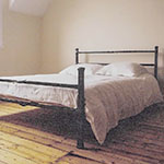 Understated but detailed metal bed