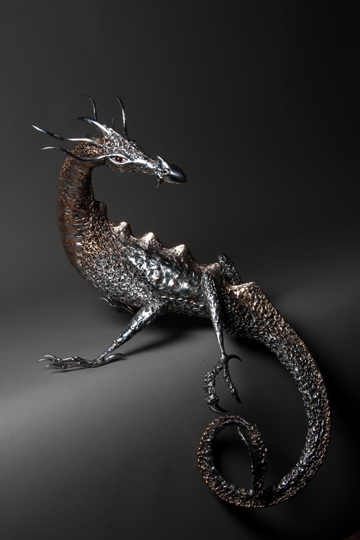 polished stainless steel and bronze dragon sculpture