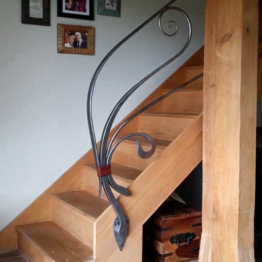 Art Nouveau inspired handrail with flowing wavy curves