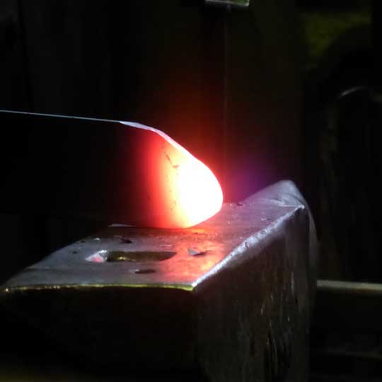 Steel being forged on an anvil