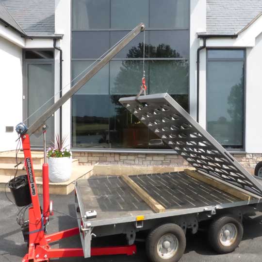 Lifting a heavy contemporary modern metal gate