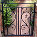 A garden gate designed to match stained glass