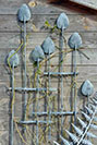 A sulptural metal garden trellis inspired by Rennie Mackintosh