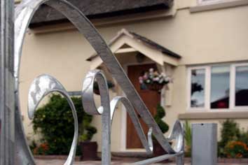 fantasy wrought iron gates; forged steel detailing