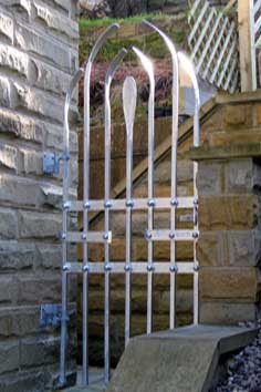 contemporary steel arched gate