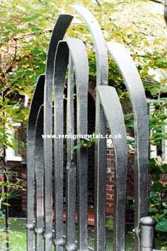 Contemporary wrought iron arch gate