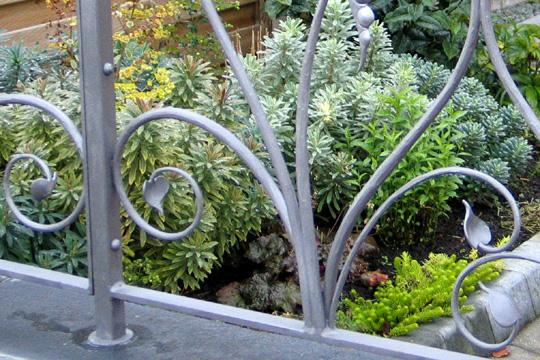 whimsical wrought iron garden railings