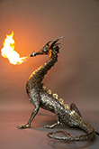 Fire breathing bronze and stainless steel dragon sculpture