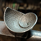 Textured steel ammonite bowl for sale