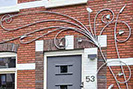 A large Art Nouveau inspired trellis for the front of a house