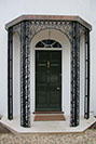 A decorative support for an Oriel window