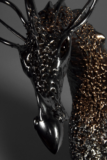 dragon face sculpture with garnet eyes