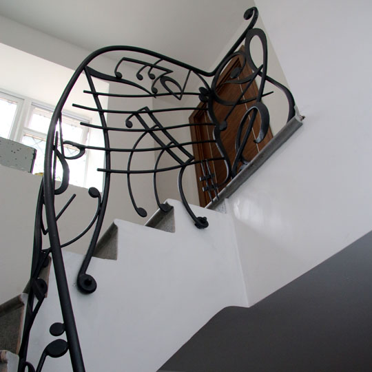 Metal gate made as a plant sculpture