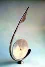 stainless steel and wrought iron clock 