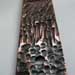 Textured and patinated copper sculpture