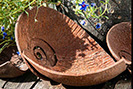 Weathered steel ammonite garden features