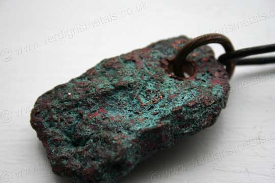 Heavily textured copper with a verdigris patina Heavily textured copper with a verdigris patina