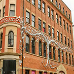Large tree sculpture on an old warehouse; Afflecks Palace in Manchester