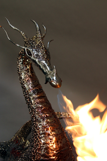 fire breathing bronze and stainless steel dragon sculpture