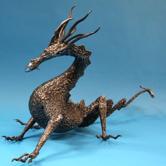 Large welded steel dragon sculpture
