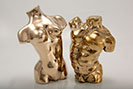 Caricature Male and female bronze torsos 