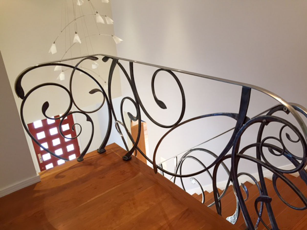 An abstract and flowing steel stair balustade An abstract and flowing steel stair balustade