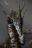 Dragon sculpture with a welded bronze texture
