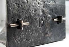 Steel clock with wedges as feature joinery
