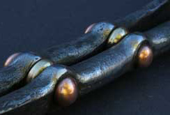 Stair balustrade with copper rivets and bronze spacers
