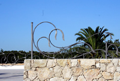A welded metal dragon sculpture