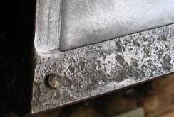 Textured steel border on a firehood